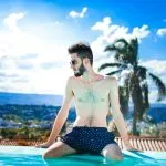 A gay man enjoying a grand resort just a short walk from everything that makes the local gay community so fun